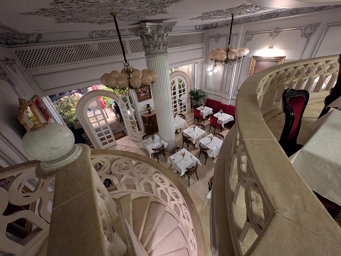Beautiful spiral staircase and dining space